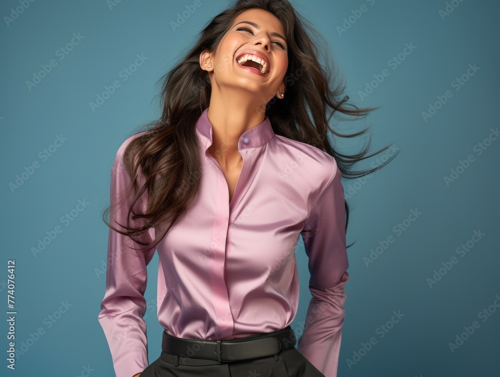 A woman is smiling and wearing a color clothing A woman is smiling and wearing a color clothing