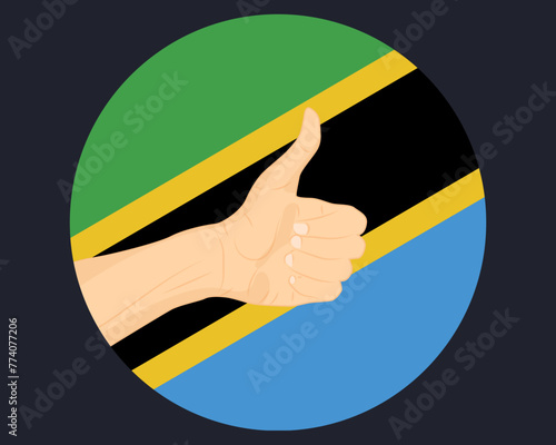 Hand approve sign with Tanzania flag, thumb up, approval or vote concept