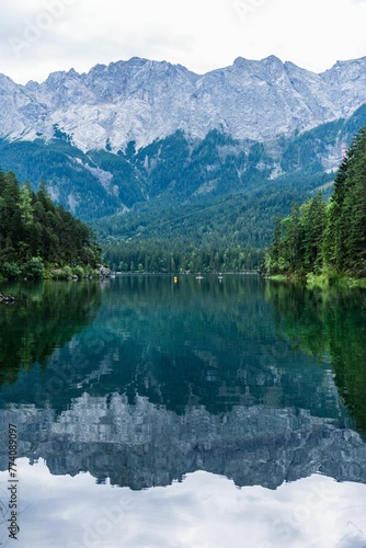 Fototapeta Naklejka Na Ścianę i Meble -  Scenery of calm hills and mountains reflecting on the lake