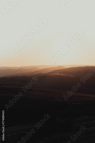 Vertical shot of sunset over Stanage Edge in Peak District  England
