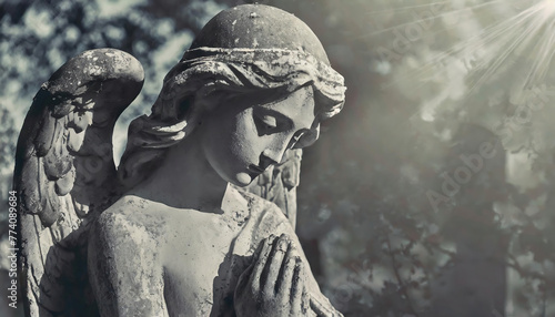 Gothic angel statue in cemetery, toned image, selective focus © Arda ALTAY