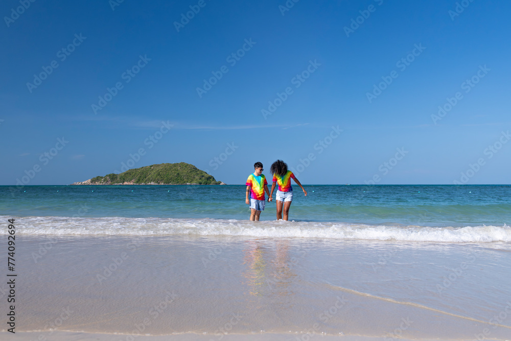 LGBTQ couple lover holding hand pose happiness life on beach in summer holidays vacation is friendship freedom equality of love concept.