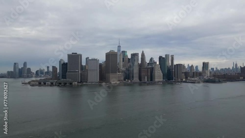 Wallpaper Mural Drone shot of city buildings with a sea view under a cloudy sky Torontodigital.ca