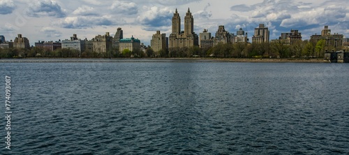 Panoramic view of luxury buildings overlooking the Jacqueline Onassis Reservoir in Central Park photo