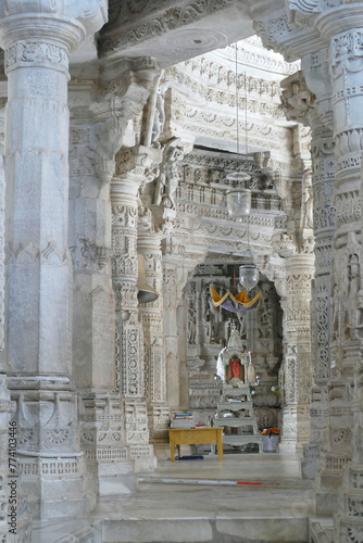 Corridor with columns in the ancient Ranakpur Jain temple in India photo
