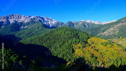 View of Chelmos mountains from Zarouchla village in Greece on a sunny autumn day.