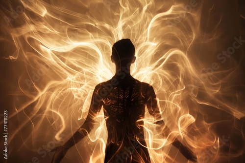 Silhouette of a human figure with dynamic light trails swirling around, conceptually illustrating energy, power or transformation.