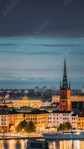 Stockholm  Sweden. Scenic View Of Stockholm Skyline At Summer Evening. Famous Popular Destination Scenic Place In Dusk Lights. Riddarholm Church In Night Lighting.