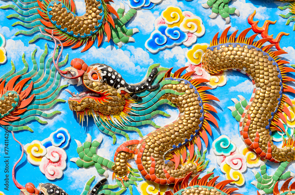 Colorful bas-relief Chinese dragon on the wall.