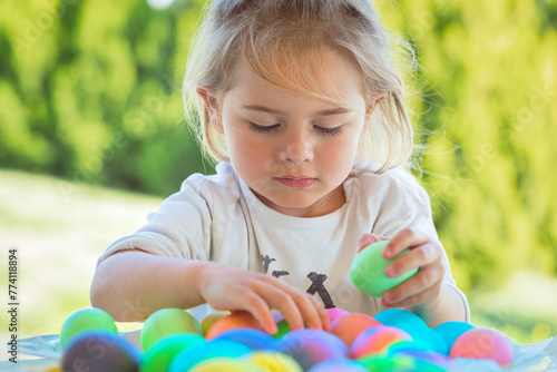 Little Boy Coloring Easter Eggs