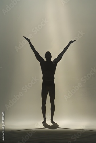 Empowered Silhouette of a Triumphant Figure Casting a Heroic Shadow