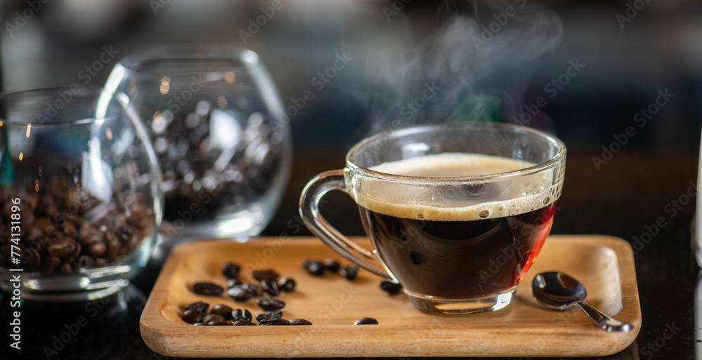 black drip coffee in glass cup, Barista making drip coffee by pouring spills hot water on coffee bean. Barista serve holding cup of hot black coffee or americano for serve on wooden table cafe shop black drip coffee in glass cup, Barista making drip coffee by pouring spills hot water on coffee bean. Barista serve holding cup of hot black coffee or americano for serve on wooden table cafe shop