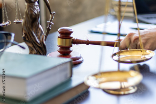 Wallpaper Mural judge holds givel wood tapped on the wooden base to read verdict for victims and defendants to know the verdict obtained from the evidence and the lawyer's defense of the case. court decision concept Torontodigital.ca