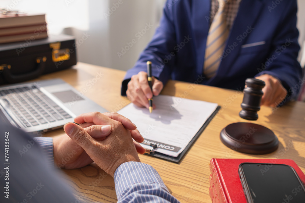 judge holds givel wood tapped on the wooden base to read verdict for victims and defendants to know the verdict obtained from the evidence and the lawyer's defense of the case. court decision concept