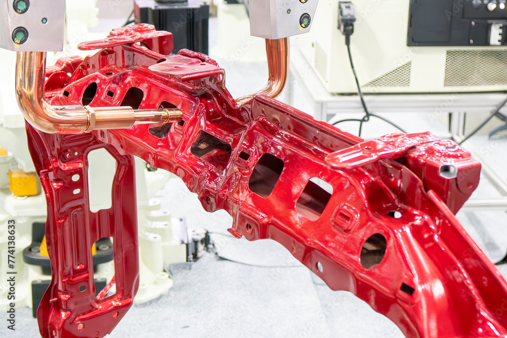 The automotive parts spot welding process by robotic system.