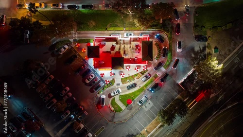 Fast Food Restaurant Cars in Drive Thru. Top Down Time Lapse View at Night.