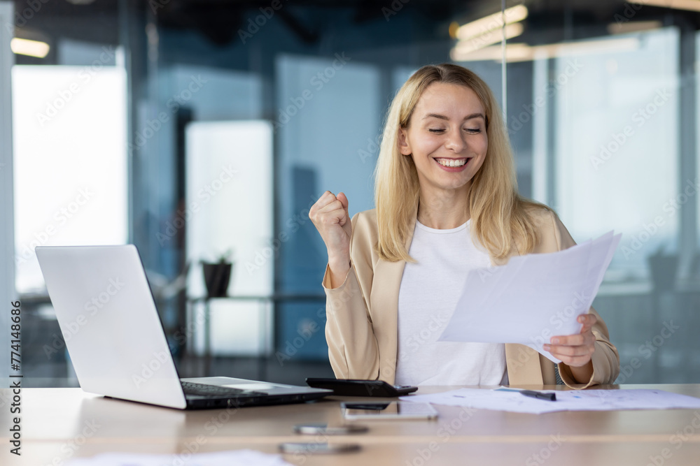 Successful businesswoman celebrating a triumph at work Successful businesswoman celebrating a triumph at work