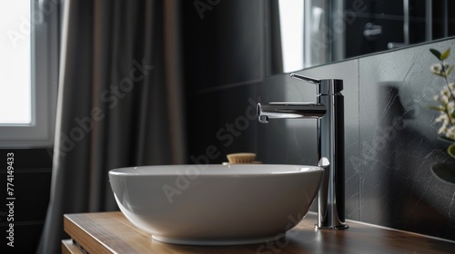 Elegant, high-quality tall basin mixer tap in a minimalist bathroom, a close-up on the modern design that sets the standard for luxury
