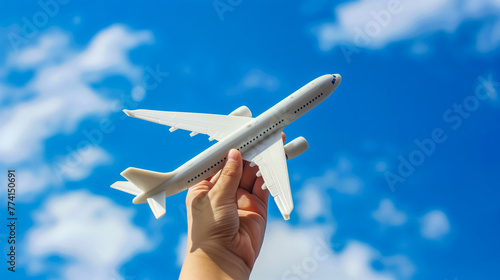 Concept of travel and freedom with a plane against a summer sky.