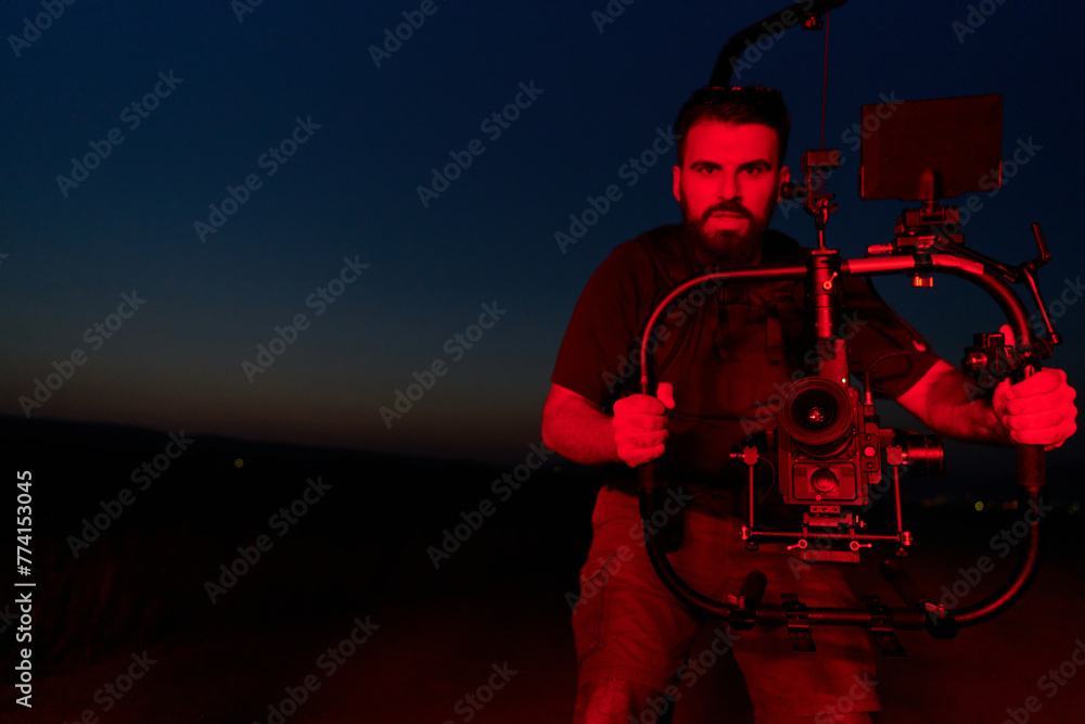 Nighttime Capture: Professional Videographer Films Athletes Running in Red-Lit Darkness Nighttime Capture: Professional Videographer Films Athletes Running in Red-Lit Darkness