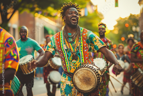 Jubilant drummer in vibrant attire celebrates Juneteenth with a street performance