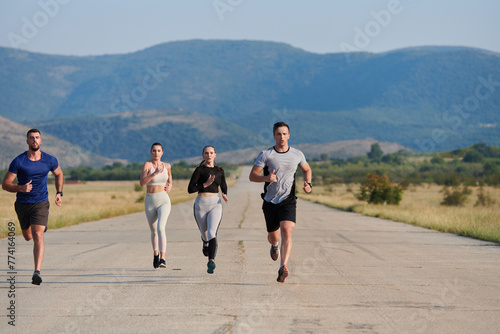 A group of friends maintains a healthy lifestyle by running outdoors on a sunny day, bonding over fitness and enjoying the energizing effects of exercise and nature © .shock