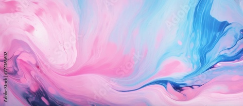 Close-up view of a painting featuring a swirling pattern in shades of pink and blue