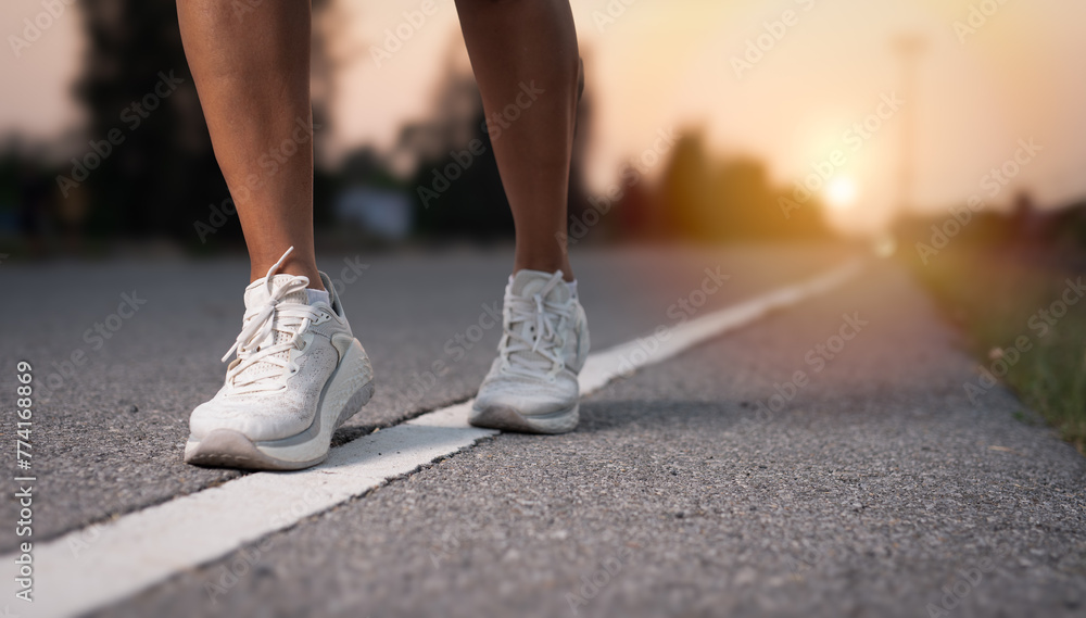 Runner feet running on road closeup on shoe,Jogging concept at outdoors