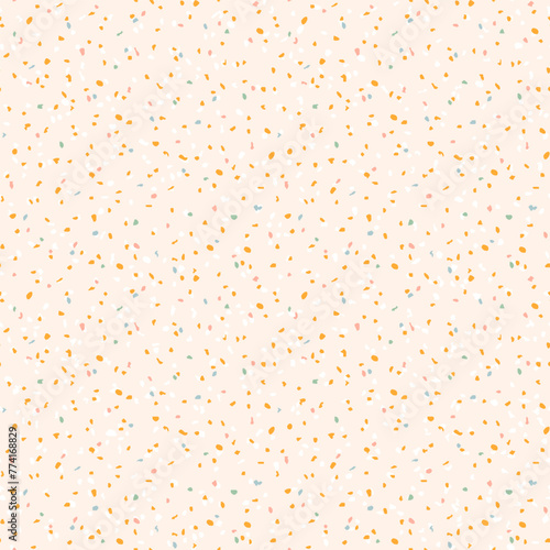 Cream, mustard yellow and pastel blue terrazzo texture background. Seamless pastel pattern.