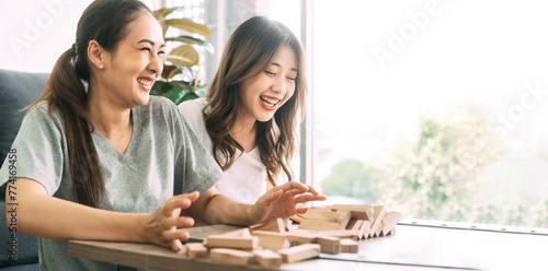 Southeast asian playing board game wooden block tower at home