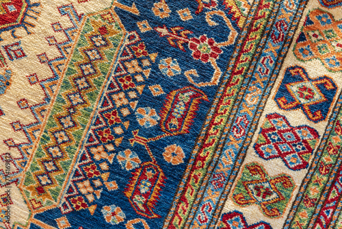 Oriental silk carpet with colorful geometric pattern