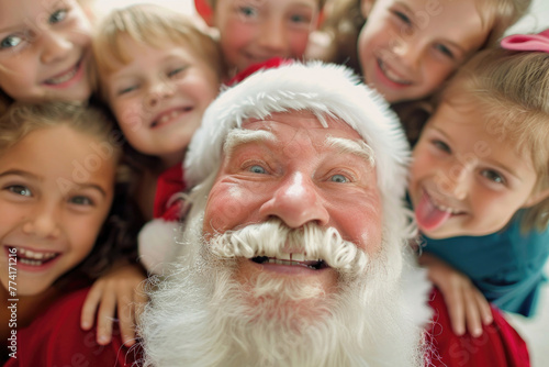 A close-up photo of Santa Claus surrounded by happy children s faces
