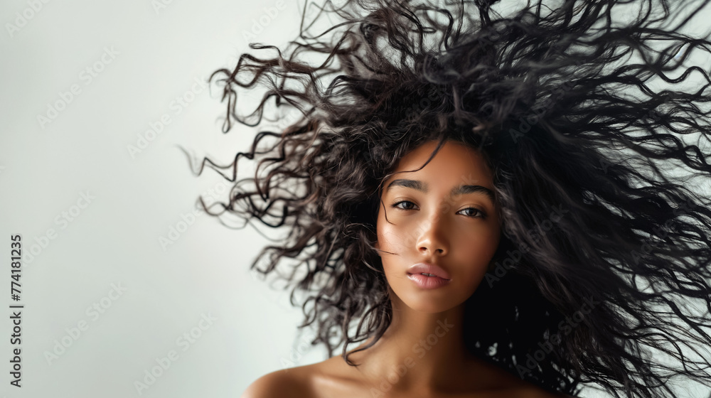Beauty Portrait of an African American Woman with Flowing Curly Hair Beauty Portrait of an African American Woman with Flowing Curly Hair