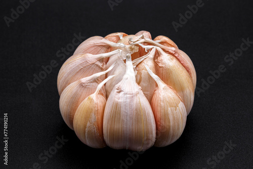 garlic bulb and clove on dark background © nutt