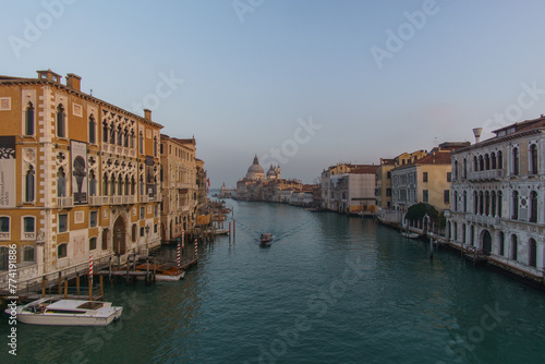 View of Grand Canal and Basilica Santa Maria della Salute seen from the Rialto Bridge on a hazy winter evening  Venice  Veneto  Italy