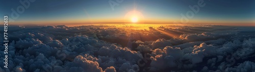 A canopy of clouds seen from above with the sun setting on the horizon