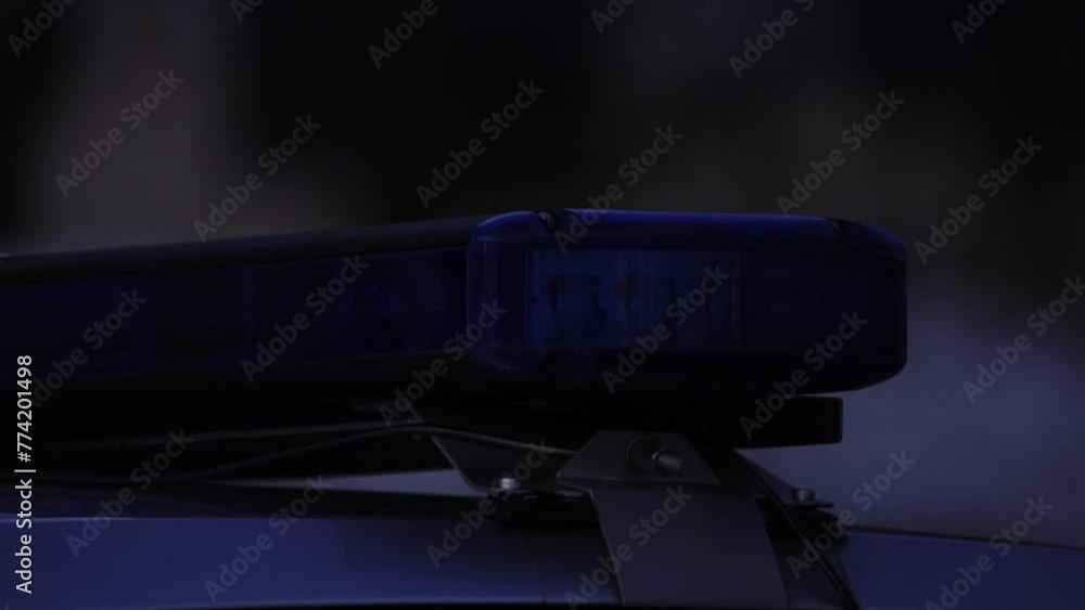 Flashlight of blue color on a police car in a dark day. Flashlight of blue color on a police car in a dark day.