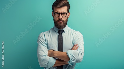 Stern Man in Glasses with Crossed Arms