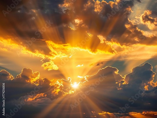 Sun peeking through dramatic clouds at dawn