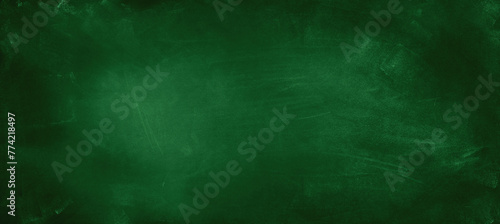 Chalk rubbed out on green chalkboard background