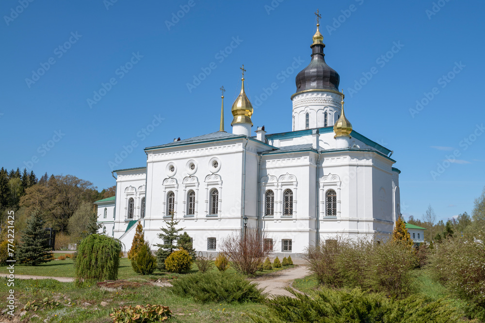 The ancient Cathedral of the Three Saints (1574) of the Spaso-Eleazarovsky convent on a sunny May day. Elizarovo. Pskov region, Russia