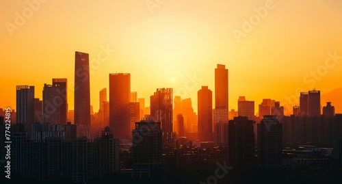 Urban skyline at sunrise, with the silhouettes of buildings set against a sky of warm hues, heralding the start of a new day. © radekcho