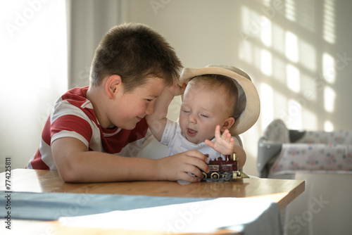 Smily brothers are play together. Family with children at home. Love, trust and tenderness