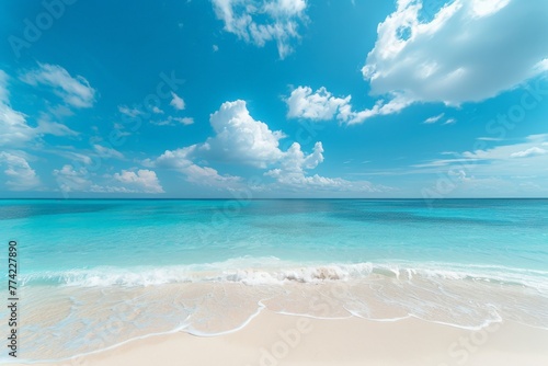 Sandy Beach With Clear Blue Water Under Cloudy Sky