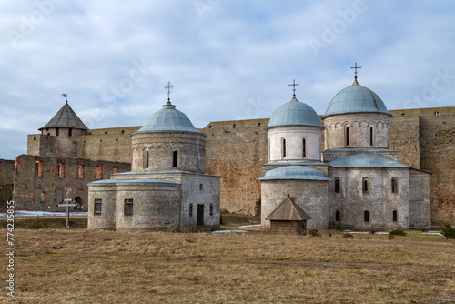 View of the ancient churches of the Ivangorod fortress on a March day. Leningrad region. Russia photo