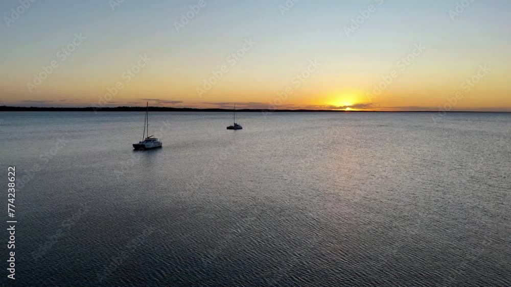 Shot of yachts at sunset in Gatakers Bay, Fraser Coast, Queensland, Australia. Shot of yachts at sunset in Gatakers Bay, Fraser Coast, Queensland, Australia.