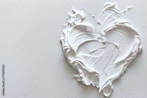 White beauty skincare cream swipe smear in heart shape on white background. Cosmetics makeup smudge swatches