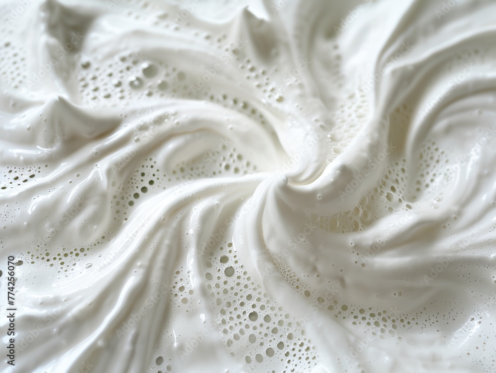 White fabric with detergent foam on it. Soaked fabric is folded in a spiral shape, creating a unique and interesting design White fabric with detergent foam on it. Soaked fabric is folded in a spiral shape, creating a unique and interesting design