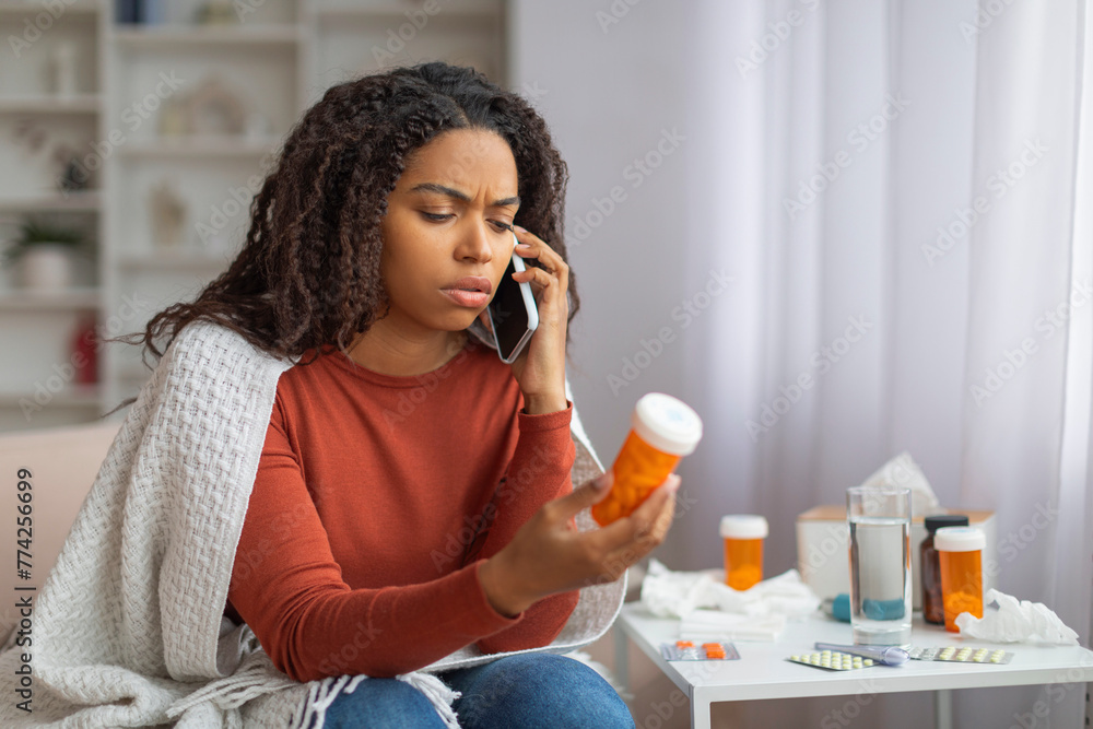 Young Black Woman Consulting With Doctor Over Phone Regarding Medication Young Black Woman Consulting With Doctor Over Phone Regarding Medication