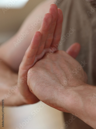 Hands of Yoga man doing Shield of Shambhala mudra close up. Inner Strength concept. Martial arts, Guardian Spirit concept